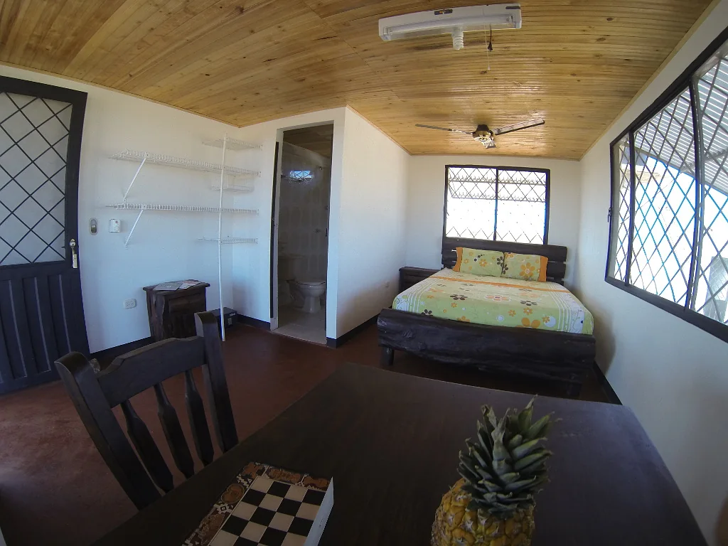 Guest room with beds and screened windows